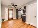 Bright living room flows into modern kitchen, featuring hardwood floors and contemporary finishes at 1945 Yosemite St, Denver, CO 80220