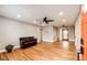 Spacious living room featuring hardwood floors, recessed lighting, and a ceiling fan at 1945 Yosemite St, Denver, CO 80220