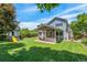 Expansive backyard featuring a well-maintained lawn, shed, play structure, and patio at 7900 E Iowa Ave, Denver, CO 80231