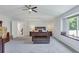 Well lit primary bedroom has a window seat and ensuite bath access at 7900 E Iowa Ave, Denver, CO 80231