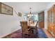 Formal dining room with hardwood floors, chandelier, and built-in china cabinet at 7900 E Iowa Ave, Denver, CO 80231