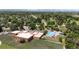 Aerial view of the neighborhood, featuring a community park with a swimming pool and a school building at 46 S Perry St, Denver, CO 80219