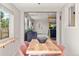 Inviting dining room with a wood table, seating for six, and lots of natural light at 46 S Perry St, Denver, CO 80219
