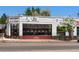 Corner building with large windows, brick accents, and signage for 