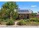 Charming home featuring solar panels, a well-manicured yard and walkway at 46 S Perry St, Denver, CO 80219