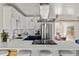 Modern kitchen with updated stainless steel appliances and a large quartz countertop at 46 S Perry St, Denver, CO 80219