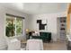 Bright living room with updated finishes, a large window, and stylish furnishings at 46 S Perry St, Denver, CO 80219