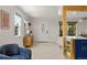 Cozy living room with an open floor plan that connects to the updated kitchen at 46 S Perry St, Denver, CO 80219