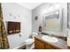 Well-lit bathroom with oak vanity, decorative accents, and neutral color scheme at 1444 S Richfield Way, Aurora, CO 80017
