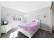 Charming bedroom with a comfortable bed, bright window, and soft lighting, great for relaxation at 1444 S Richfield Way, Aurora, CO 80017