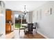 Charming dining area features backyard access through sliding glass doors at 1444 S Richfield Way, Aurora, CO 80017