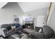 Bright living room with fireplace, comfortable seating, and stylish geometric rug at 1444 S Richfield Way, Aurora, CO 80017