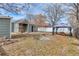 Backyard showing a gazebo, firepit, and a partial view of home's exterior at 6660 Locust St, Commerce City, CO 80022