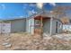Backyard view showcasing partial view of home, gated entrance, and patio at 6660 Locust St, Commerce City, CO 80022