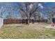 Backyard featuring a canopy with curtains over a picnic table and room for outdoor living at 6660 Locust St, Commerce City, CO 80022