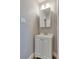 Bathroom with a single vanity, a mirrored medicine cabinet, and a neutral color scheme at 6660 Locust St, Commerce City, CO 80022