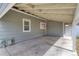 Covered carport area with access to the backyard and house at 6660 Locust St, Commerce City, CO 80022