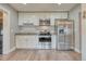Bright kitchen featuring stainless steel appliances, ample cabinet space, and durable countertops at 6660 Locust St, Commerce City, CO 80022