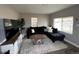 Stylish living room with modern furniture, natural light, and comfortable seating at 6660 Locust St, Commerce City, CO 80022