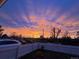 Beautiful sunrise view from the front yard with vibrant colors over the neighborhood at 6660 Locust St, Commerce City, CO 80022
