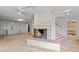 Basement Gathering room featuring a fireplace and stairs leading to the upper level at 7350 Field St, Arvada, CO 80005