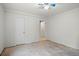 Basement features bare floors and doorway leading to another room at 7350 Field St, Arvada, CO 80005