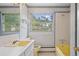 Bathroom featuring a window and a bathtub at 7350 Field St, Arvada, CO 80005