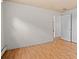 Bedroom featuring hardwood floors, white walls, and a doorway at 7350 Field St, Arvada, CO 80005