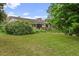 Single-story home featuring a well-maintained lawn and a blend of brick and wood exterior at 7350 Field St, Arvada, CO 80005