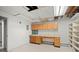Spacious workshop area with built-in cabinets and a large countertop, perfect for projects at 7350 Field St, Arvada, CO 80005
