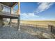 A walk-out basement has a covered deck overlooking the backyard and community open space at 2978 Newfound Lake Rd, Berthoud, CO 80513