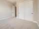 Comfortable bedroom featuring carpet, closet and doorway at 2978 Newfound Lake Rd, Berthoud, CO 80513