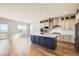 Modern kitchen with stainless steel appliances, quartz counters, and an open floorplan at 2978 Newfound Lake Rd, Berthoud, CO 80513