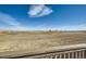 The back porch overlooks an open community area, with a pond at 2978 Newfound Lake Rd, Berthoud, CO 80513