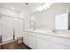 A modern bathroom features a glass-enclosed shower and dual sinks with ample counter space at 1264 Penner Dr, Erie, CO 80026