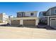 A modern two-story home with attached two-car garage featuring a neutral color scheme at 1264 Penner Dr, Erie, CO 80026