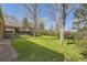 Lush backyard featuring well manicured lawn and mature landscaping at 2991 S Fillmore Way, Denver, CO 80210