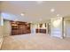 Spacious carpeted basement with built-in shelving and bar area at 2991 S Fillmore Way, Denver, CO 80210