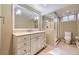 Well-lit bathroom with marble vanity, glass shower, and modern fixtures at 2991 S Fillmore Way, Denver, CO 80210