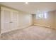 Neutral bedroom featuring a window and closet space for storage at 2991 S Fillmore Way, Denver, CO 80210