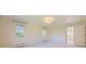 Bright, carpeted bedroom with large windows and neutral walls at 2991 S Fillmore Way, Denver, CO 80210