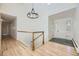 Bright foyer with hardwood floors, a skylight, and white trim with leaded glass sidelights at 2991 S Fillmore Way, Denver, CO 80210