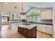 Gourmet kitchen with a center island, granite countertops, and modern appliances at 2991 S Fillmore Way, Denver, CO 80210