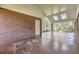 Covered patio with brick wall, skylights and concrete floors at 2991 S Fillmore Way, Denver, CO 80210