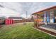 Large backyard with storage shed and grassy area at 8089 Greenwood Blvd, Denver, CO 80221