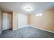 Finished basement bedroom with neutral walls and carpet at 8089 Greenwood Blvd, Denver, CO 80221