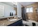 Bathroom with granite countertop and tile shower/tub at 8089 Greenwood Blvd, Denver, CO 80221