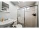 Basement bathroom with shower stall and pedestal sink at 8089 Greenwood Blvd, Denver, CO 80221