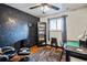 Bedroom with dark-colored accent wall and workspace at 8089 Greenwood Blvd, Denver, CO 80221