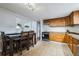 Eat-in kitchen with wood cabinets and tile floor at 8089 Greenwood Blvd, Denver, CO 80221